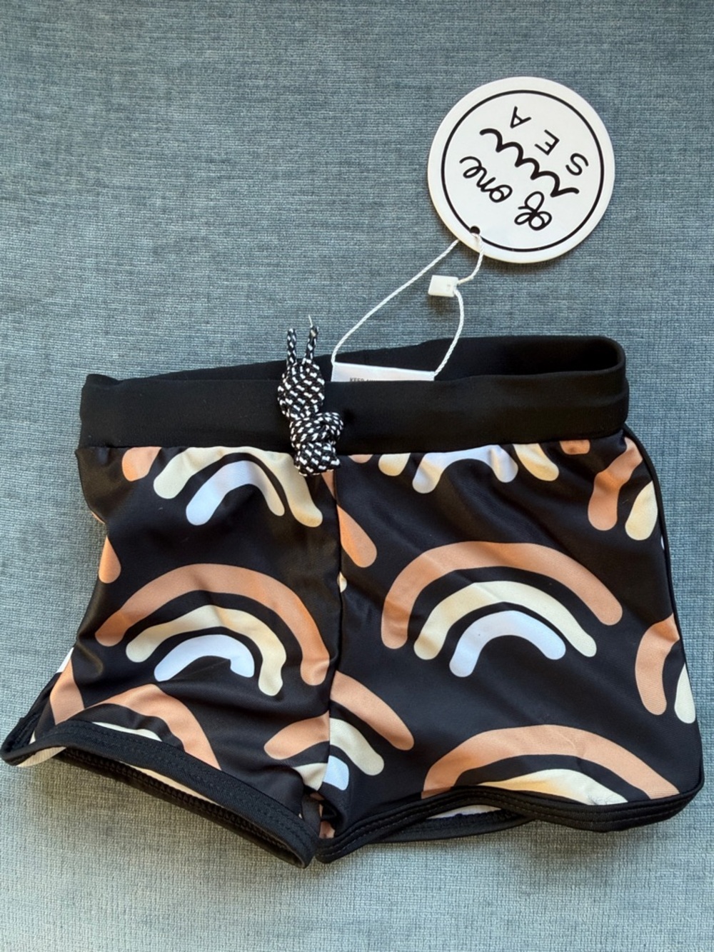 Kids Black Swim Trunks with Tan & Cream Rainbow Print
